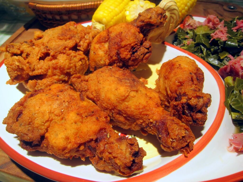 Fried chicken has been used to mock and ridicule black people, but "we love chicken" advises that food defines no one.  A person's identity is defined by the life he lives.